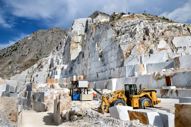 istock Industrial machinery in an open cast marble quarry 1268967833