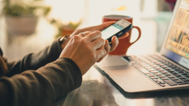istock Young woman working on her laptop from home drinking coffee 1268970997