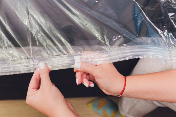 istock Space saver saving seal bag sucking air out , vacuum clothing storage compressed package. 1268993193