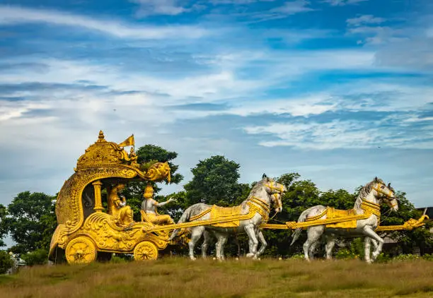 holly Arjuna chariot of Mahabharata in golden color with amazing sky background image is taken at murdeshwar karnataka india.
