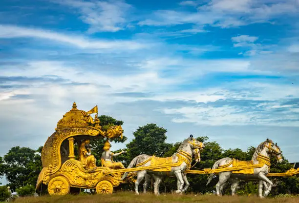 holly Arjuna chariot of Mahabharata in golden color with amazing sky background image is taken at murdeshwar karnataka india.