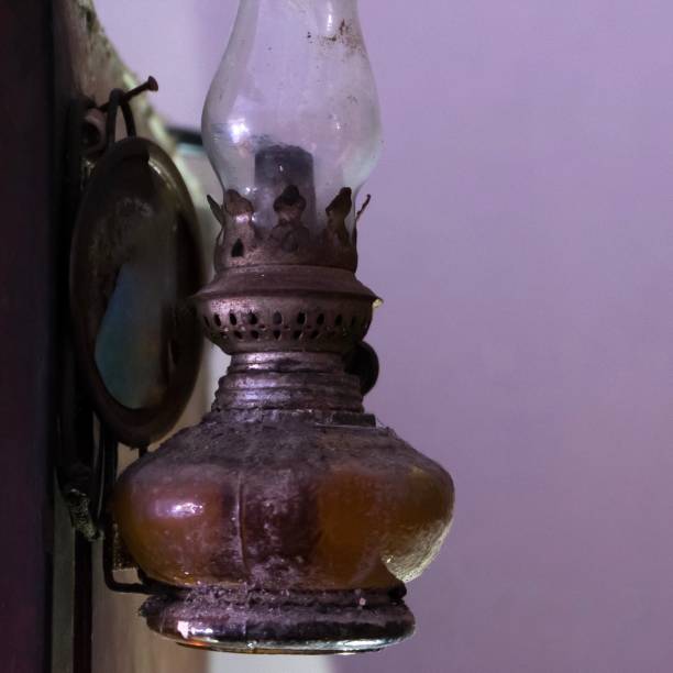 istock Old oil lamp hanging on the wall. 1269015727