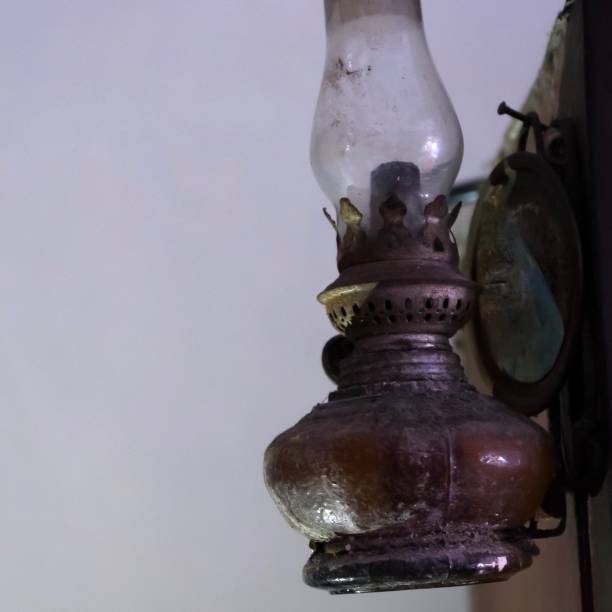 istock Old oil lamp hanging on the wall. 1269015729