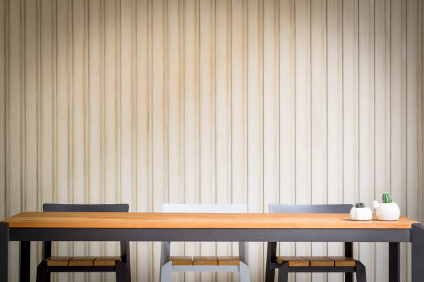 istock closeup high wooden bar table and chairs 1269018266