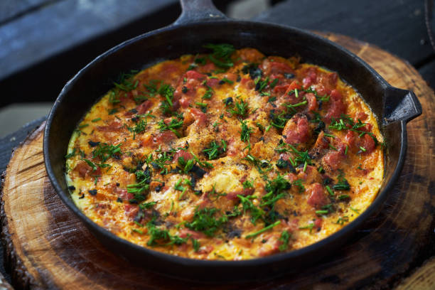 istock Shakshuka breakfast with fried egg and tomato in a pan 1269020736