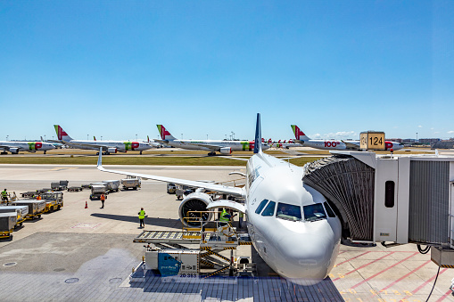 Lisbon, Portugal - June 8, 2020: Lufthansa aircraft at the gate. Tap aircraft are parked at the apron due to corona shutdown and reduced flightplan.
