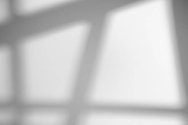 istock The shadow from the window on a white wall in sunny weather with bright light. Shadow overlay effect for photo. 1269027145