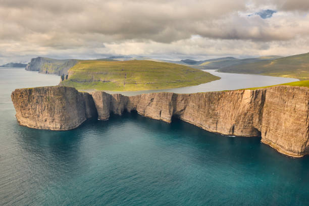 Faroe islands dramatic coastline in Vagar. Leitisvatn lake
