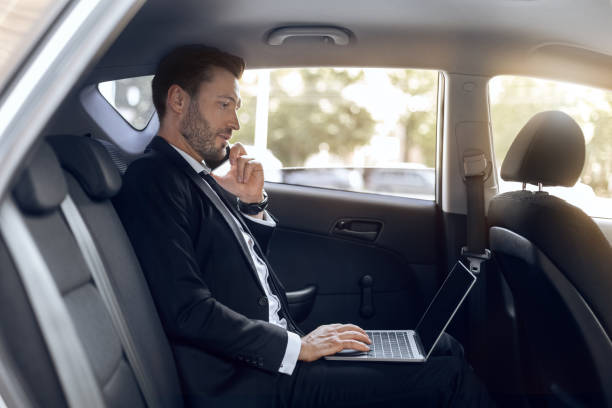 istock Busy entrepreneur working on laptop, talking on phone 1269028411