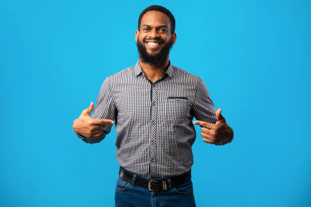 istock Happy young man pointing fingers at himself 1269028538