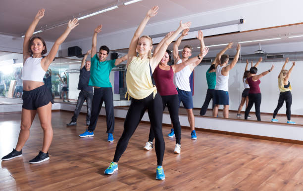 istock Laughing positive people learning zumba steps 1269029317