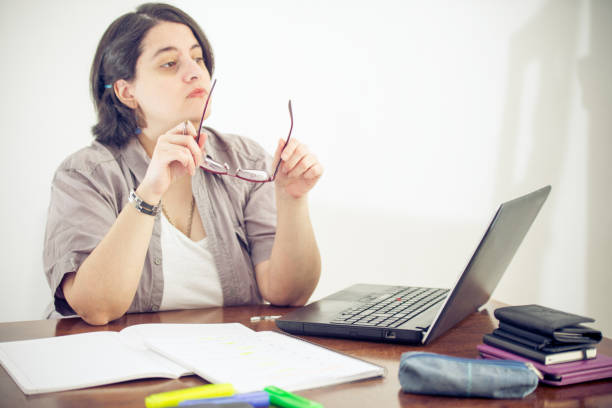 istock Adult Student With Eyeglasses Studying Indoors 1269030045