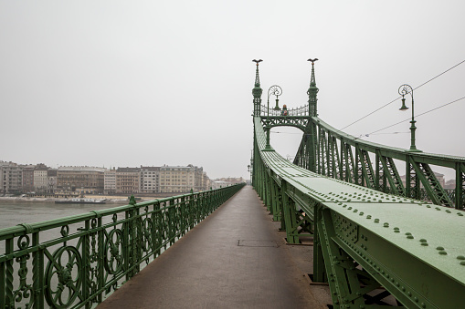 Liberty Bridge, known as Szabadság híd in Hungarian,  over the Danube in Budapest on a misty day, Hungary