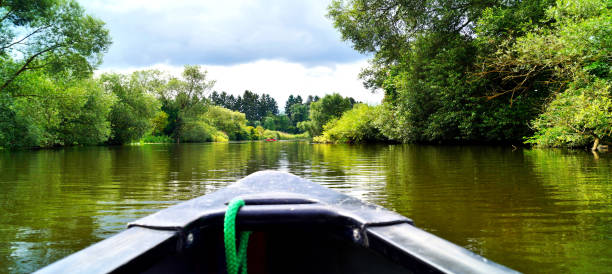 istock Canoeing through a river. boat ride. old canoe on river Lahn in germany. 1269031593