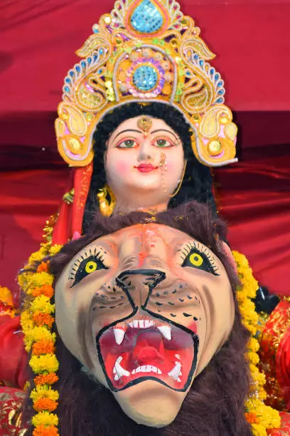 Photo of Sculpture of Hindu Goddess Durga, Goddess Durga idol with ornaments in close up side face view