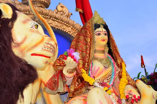 Photo of Sculpture of Hindu Goddess Durga, Goddess Durga idol with ornaments in close up side face view