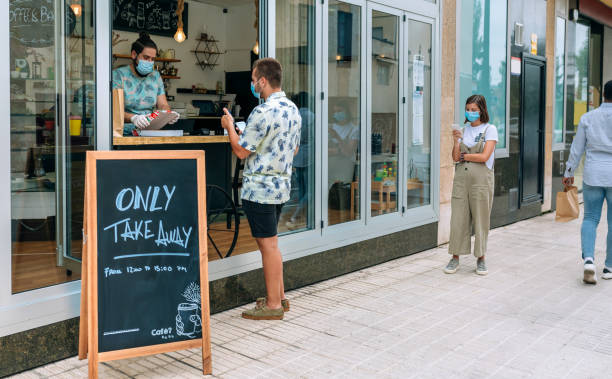 istock Man picking up take away food order 1269033143
