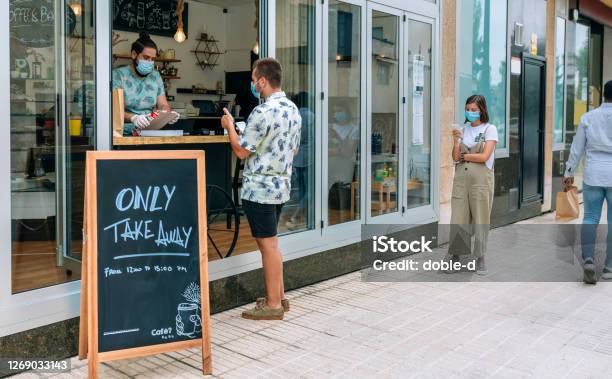 Man Picking Up Take Away Food Order Stock Photo - Download Image Now - Restaurant, Coronavirus, Take Out Food