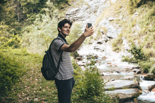 istock Young Adult Man using phone in Limone Piemonte 1269033489