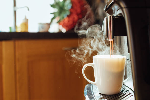 istock Close-up of coffee machine making steaming coffee on vintage kitchen. 1269034561
