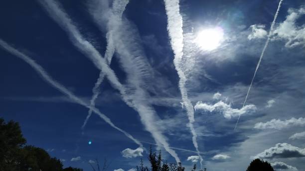 istock Condensate stripes on a blue sky. 1269035985