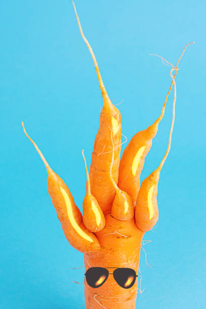 istock Strange carrots with painted sunglasses. 1269036325