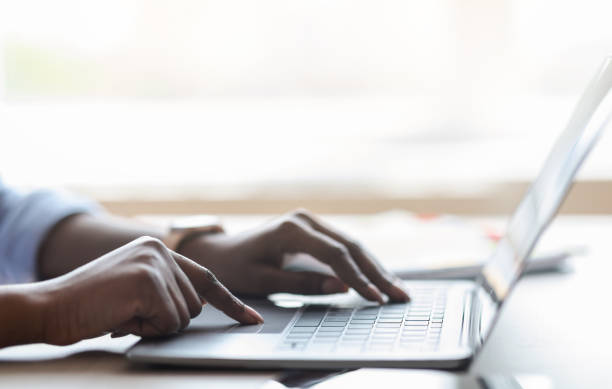 istock Closeup of unrecognizable black female working on laptop, typing on computer keyboard 1269039273