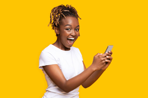 istock Excited black woman using mobile phone, got new nice app 1269039330