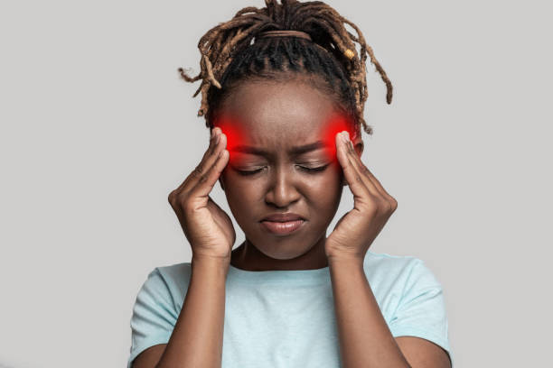 istock Upset african girl touching her lightened with red temples 1269039648