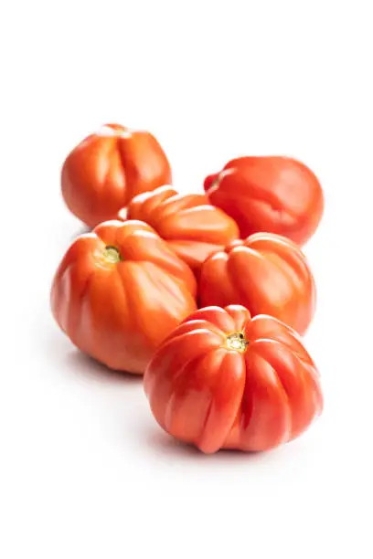 Red beefsteak tomatoes isolated on white backround.