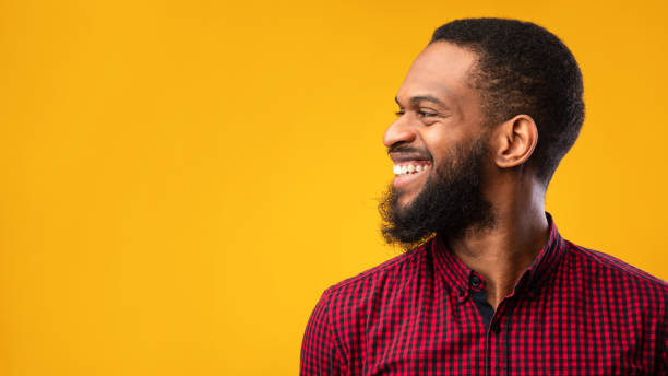 istock Side portrait of masculine afro guy looking at copyspace 1269042357