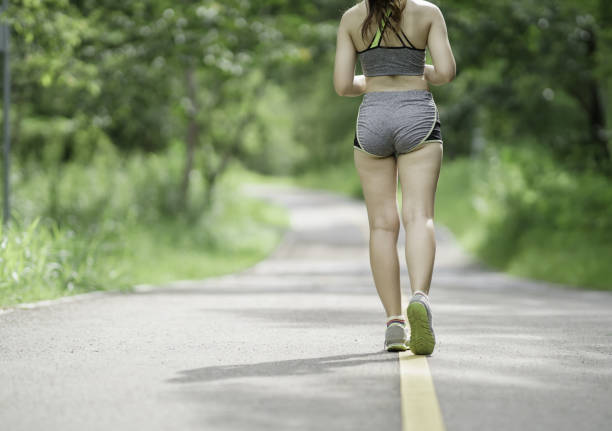 istock Young woman running outdoors. 1269043709