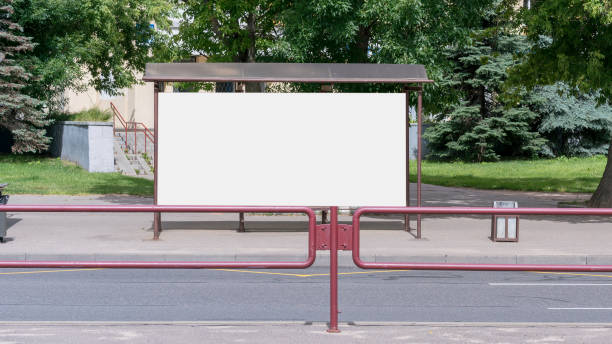 istock city bus stop with white blank advertise banner with mock-up 1269044039