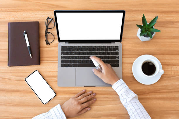 istock Woman using antiseptic spray to disinfect laptop 1269045656
