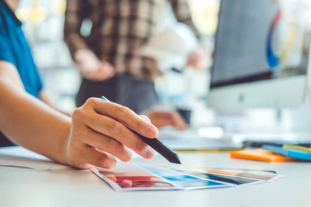 istock Two Graphic designer Brainstorming Meeting and drawing on graphics tablet at workplace 1269045947