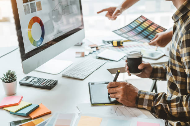 istock Two Graphic designer Brainstorming Meeting and drawing on graphics tablet at workplace 1269045976