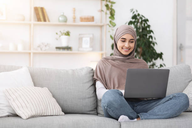 istock Modern Freelance Concept. Young arabic woman working on laptop computer at home 1269048825