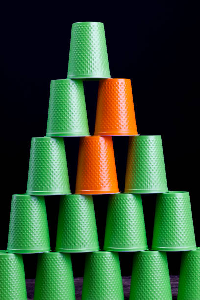 istock orange and many green plastic cups 1269049232