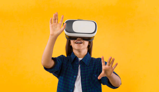 istock Little girl wearing virtual reality goggles at studio 1269049945