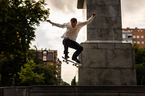 Skater doing big jump on his skateboard