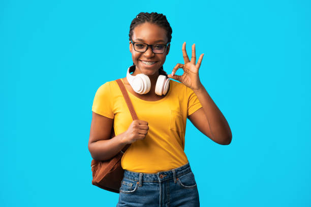 istock African Student Girl Gesturing Ok Posing Over Blue Background, Studio 1269063729