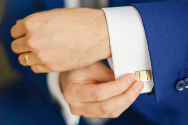 istock Groom or businessman fasten cufflink 1269069516
