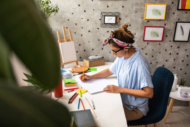 istock Female artist drawing at home 1269074819