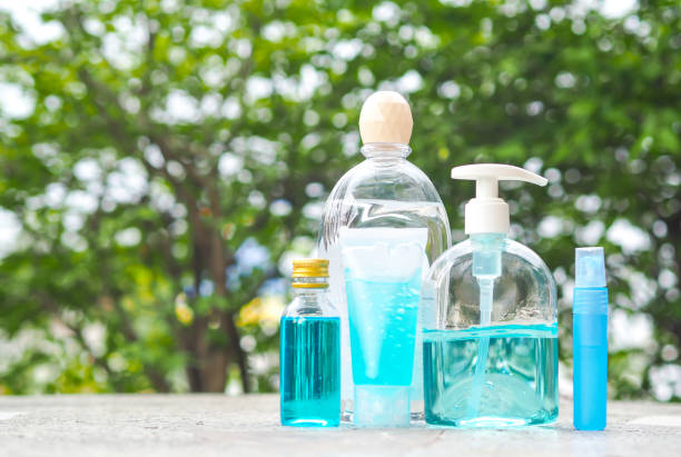 istock Alcohol Gel in plastic bottle on table with blur nature background. 1269076338