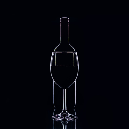 Red wine bottle and glass close-up