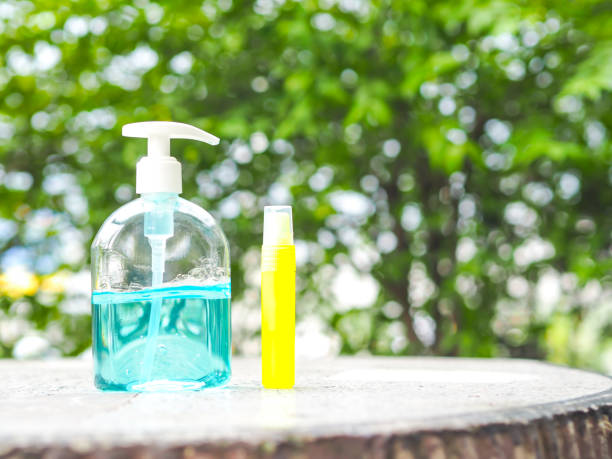 istock Alcohol Gel in plastic bottle on table with blur nature background. 1269077776