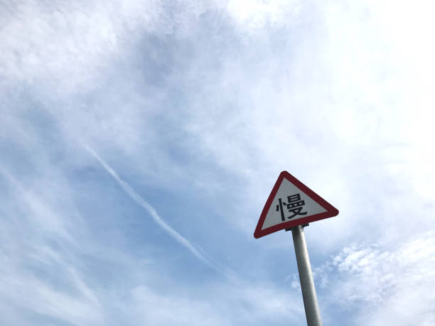 istock Road sign and blue sky 1269077777