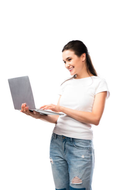 istock brunette woman in white t-shirt using laptop isolated on white 1269077938