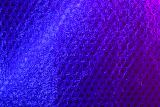 istock bubble pack in neon color. Abstract light blue and pink neon background texture in colorful gradient. 1269092197