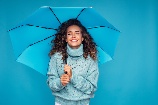 Girl with blue umbrella